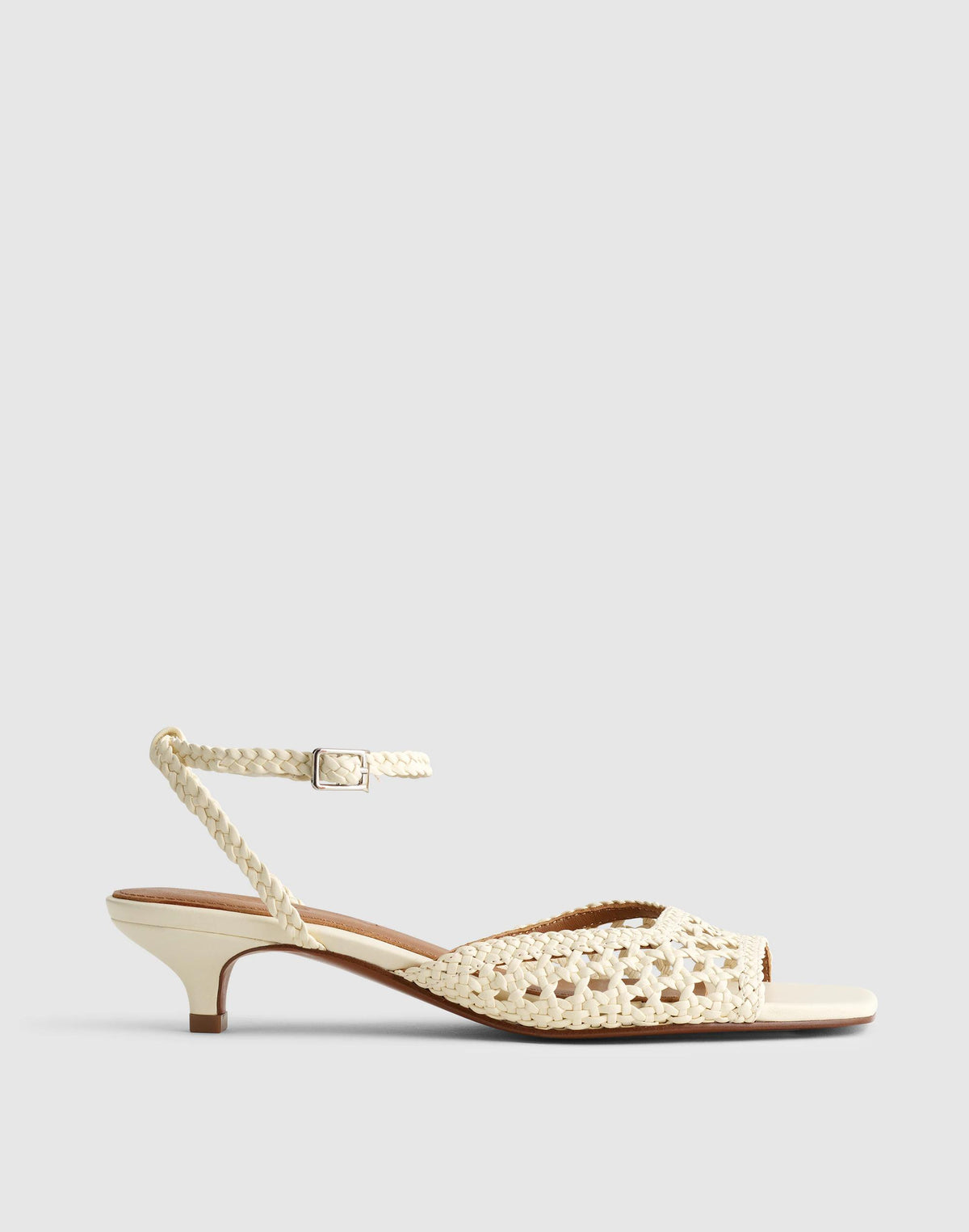 The Tyra Ankle-Strap Kitten-Heel Sandal in Woven Leather