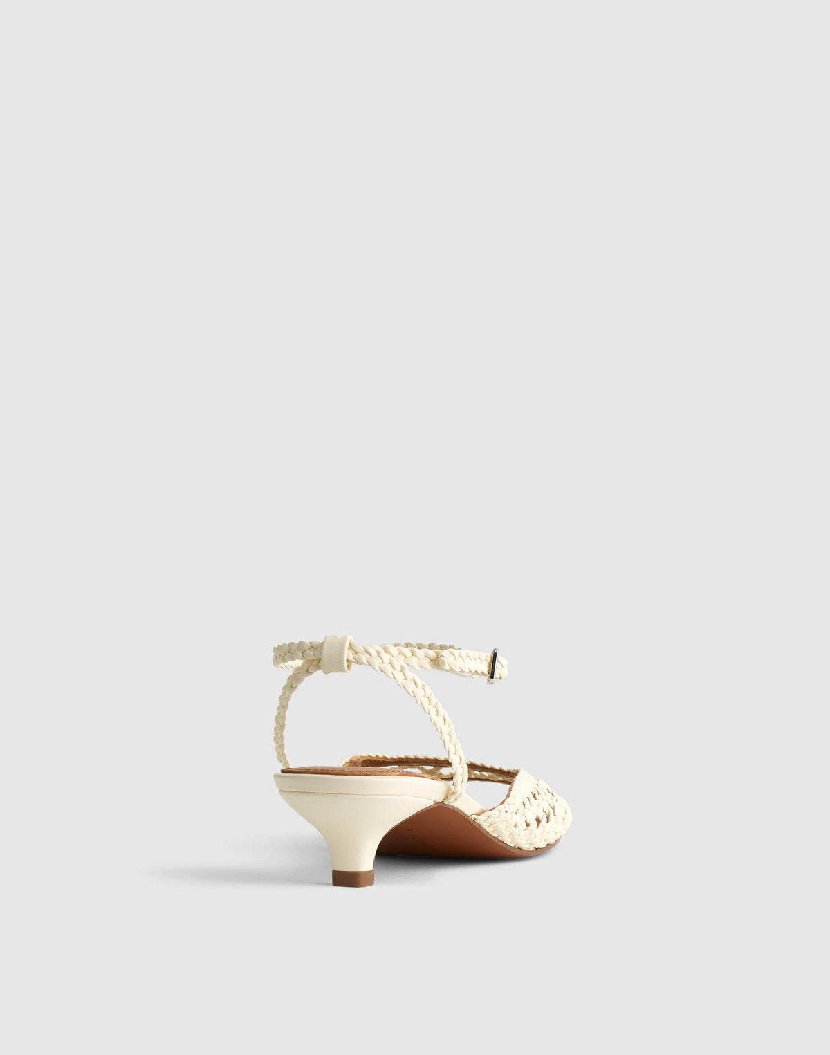 The Tyra Ankle-Strap Kitten-Heel Sandal in Woven Leather